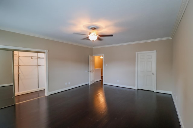 unfurnished bedroom featuring ornamental molding, dark wood-type flooring, and ceiling fan