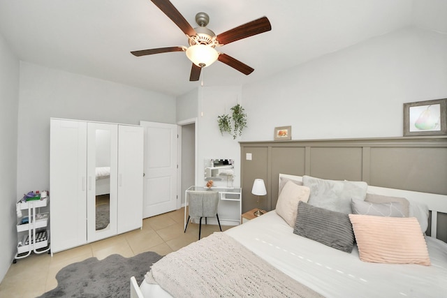 tiled bedroom with ceiling fan