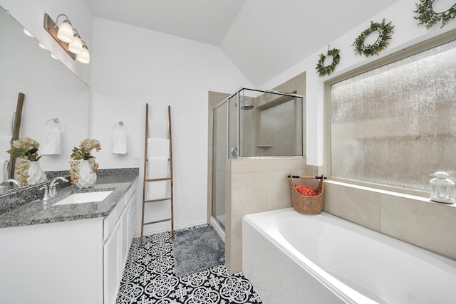 bathroom with shower with separate bathtub, lofted ceiling, and vanity