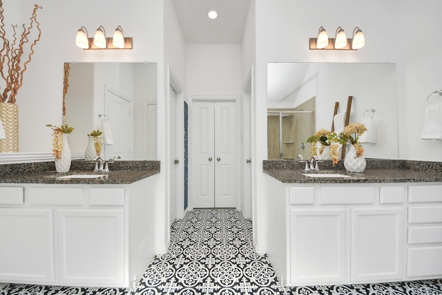 bathroom featuring vanity and an enclosed shower