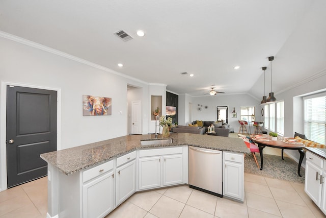 kitchen featuring a center island, sink, stainless steel dishwasher, and white cabinets