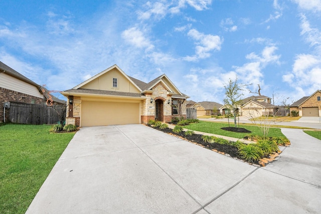 view of front of home with a garage and a front lawn