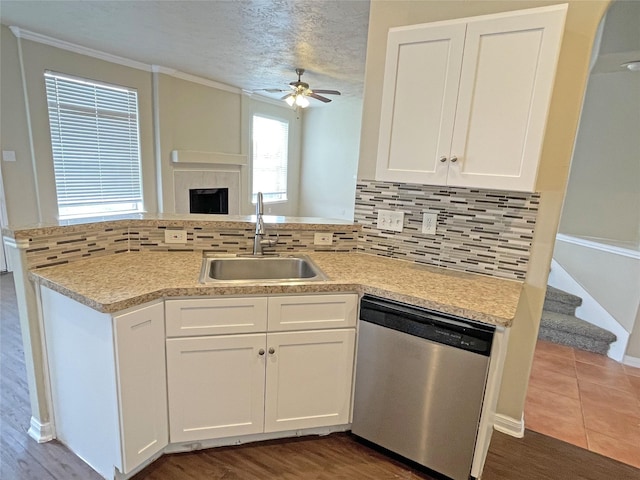 kitchen featuring white cabinetry, ceiling fan, dishwasher, and sink