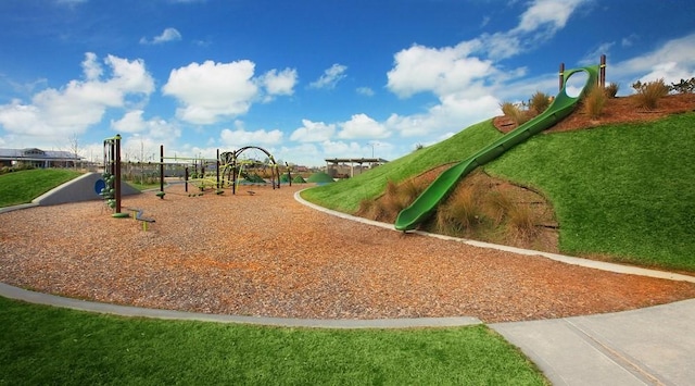 community play area featuring a yard