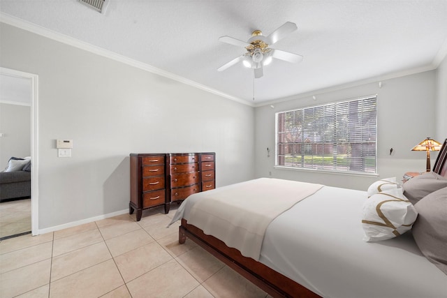 tiled bedroom featuring ornamental molding, a textured ceiling, and ceiling fan