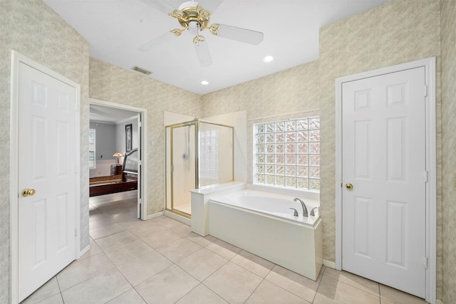 bathroom featuring tile patterned flooring, independent shower and bath, and ceiling fan