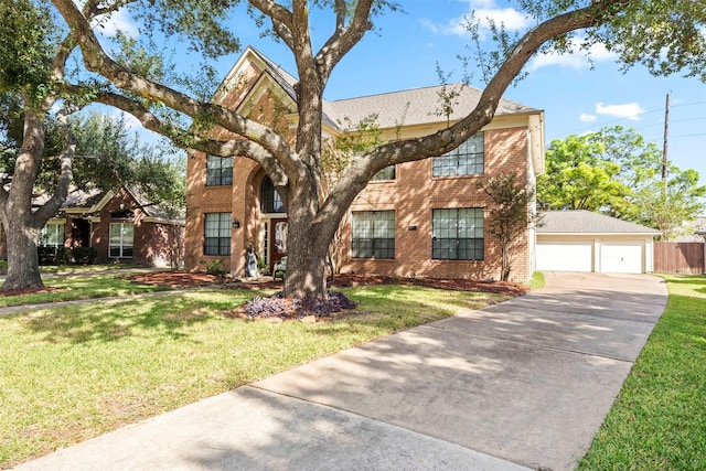 view of front of house with a garage and a front lawn