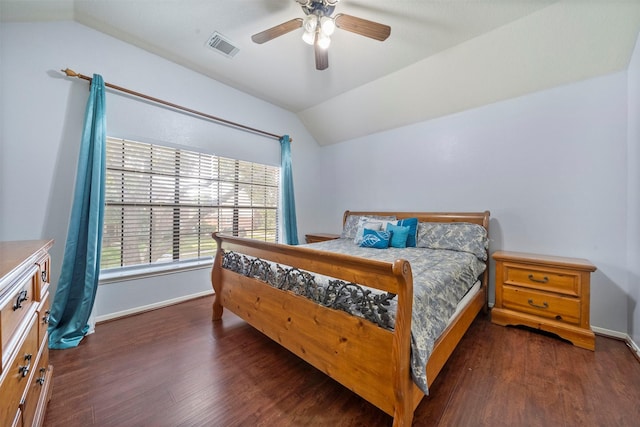 bedroom featuring lofted ceiling, dark wood-type flooring, and ceiling fan