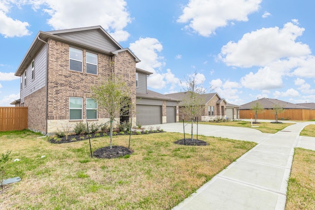 view of front of property with a garage and a front lawn