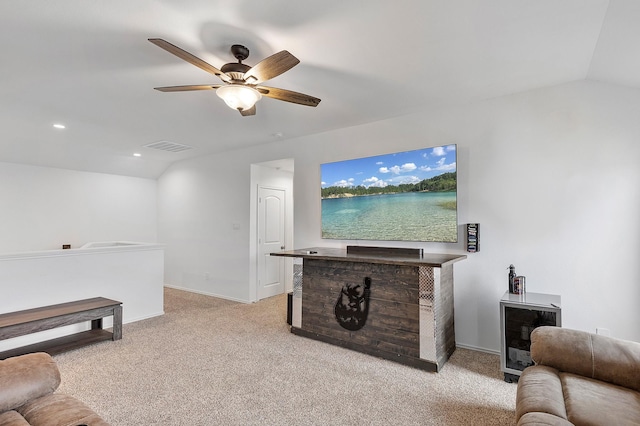 living room featuring lofted ceiling, light colored carpet, and ceiling fan