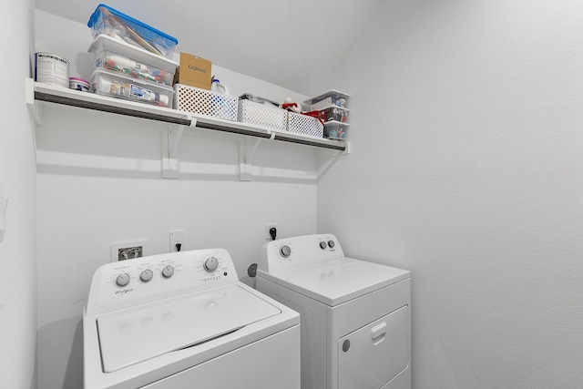 laundry room featuring washing machine and clothes dryer