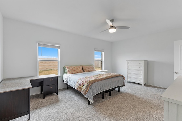 bedroom with light carpet and ceiling fan