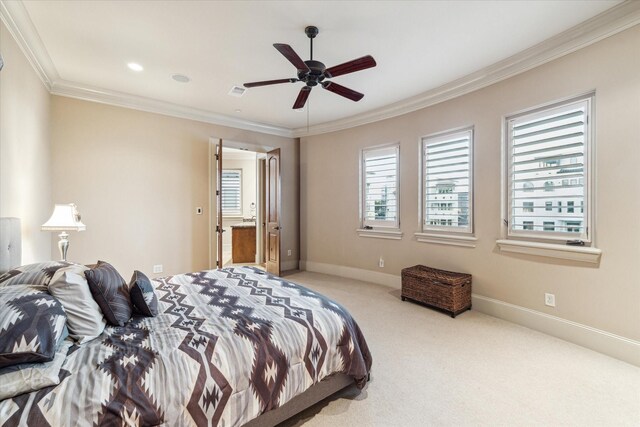 carpeted bedroom with ornamental molding and ceiling fan