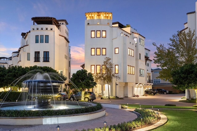 view of outdoor building at dusk