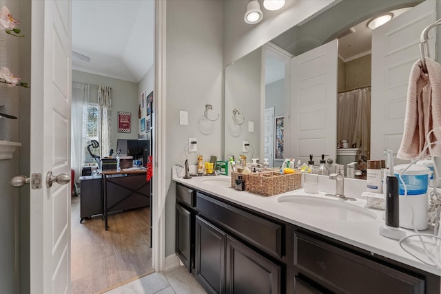 bathroom featuring tile patterned flooring and vanity