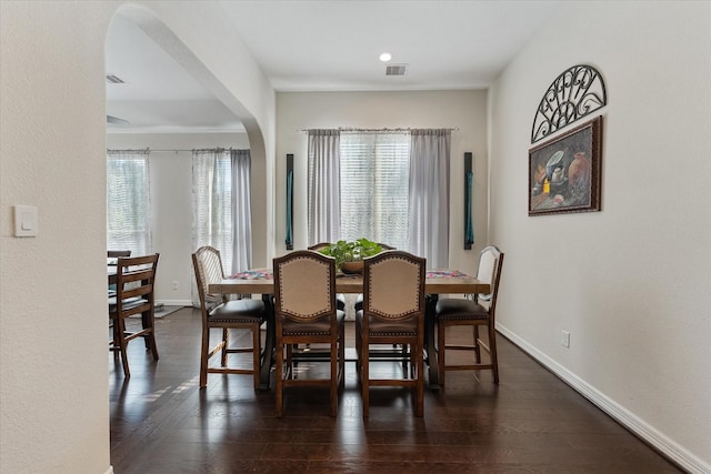 dining space featuring dark hardwood / wood-style floors