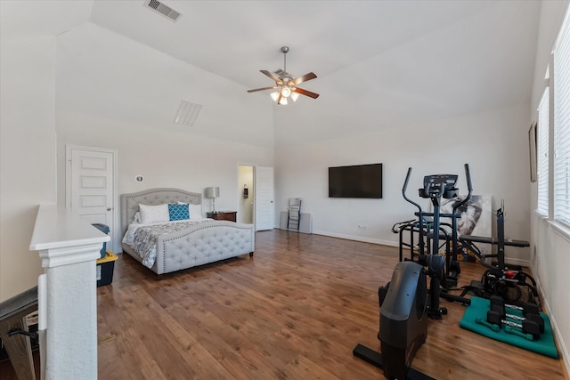 bedroom featuring high vaulted ceiling, dark hardwood / wood-style floors, and ceiling fan