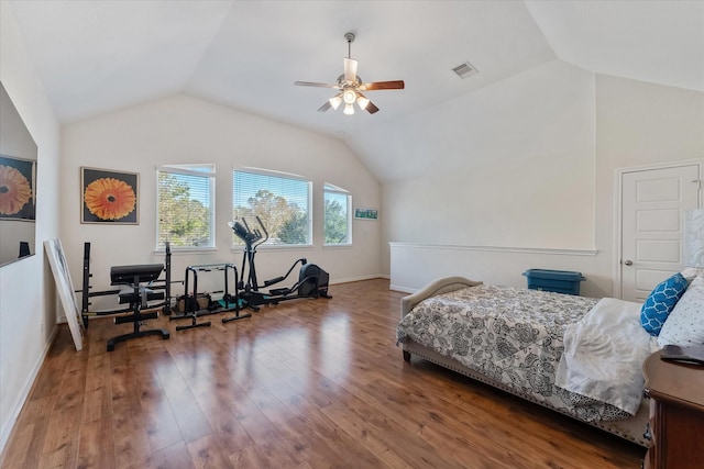 bedroom featuring hardwood / wood-style flooring, vaulted ceiling, and ceiling fan