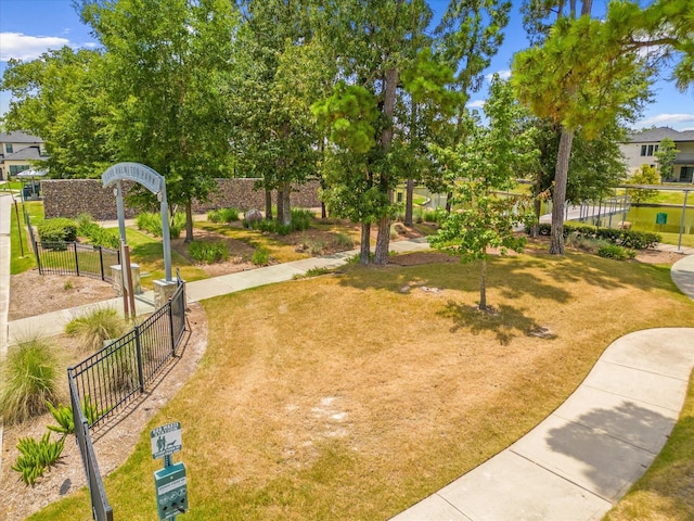 view of home's community featuring a yard