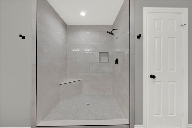 bathroom with tiled shower