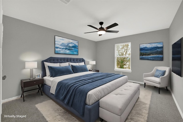 bedroom featuring ceiling fan and light carpet