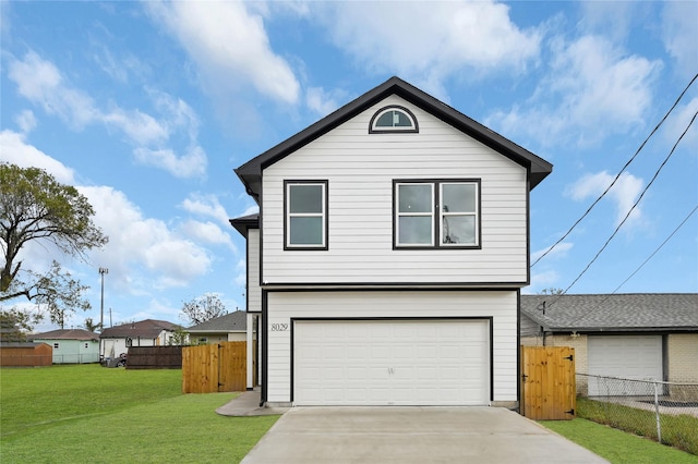 front facade featuring a garage and a front lawn