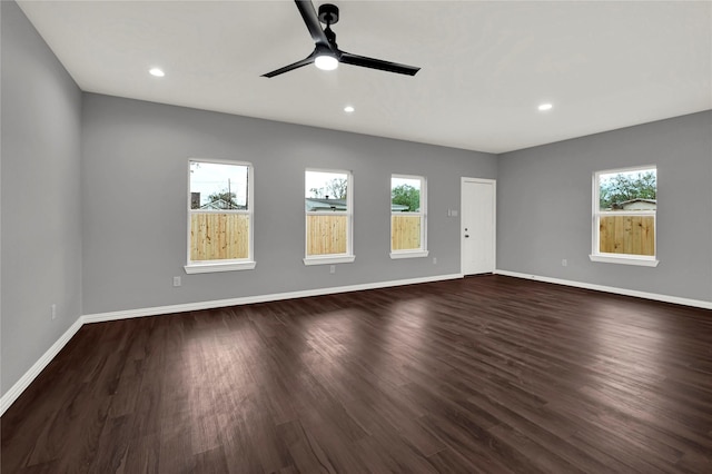 unfurnished room featuring dark hardwood / wood-style floors and ceiling fan