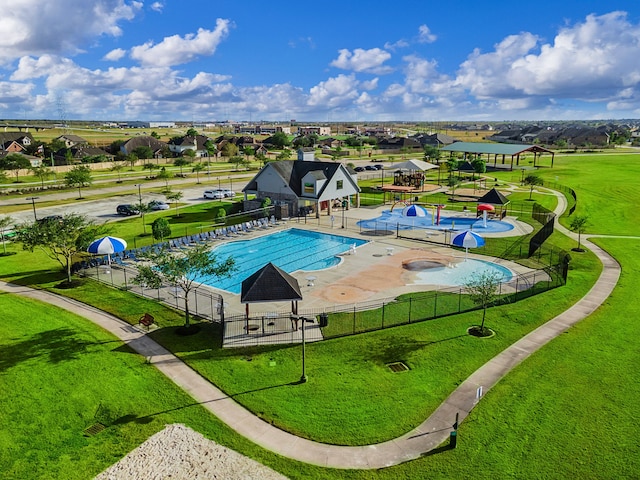 view of pool with a yard and a patio area