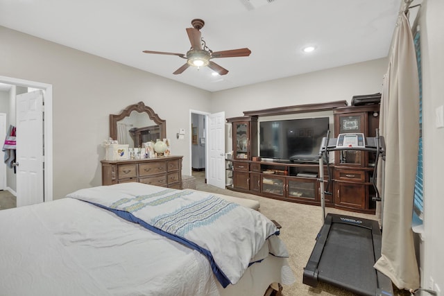 bedroom featuring light colored carpet and ceiling fan