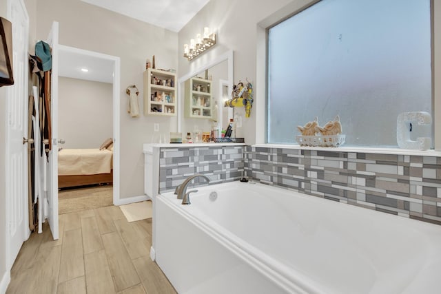 bathroom featuring a tub to relax in