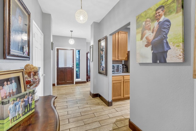 foyer with a chandelier