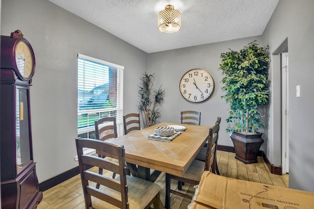 dining space with a textured ceiling