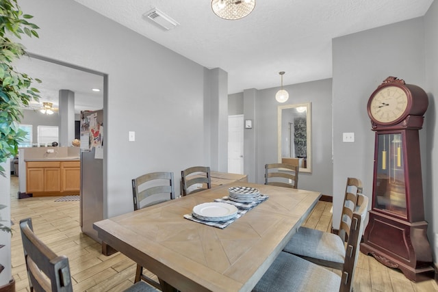 dining room with a textured ceiling