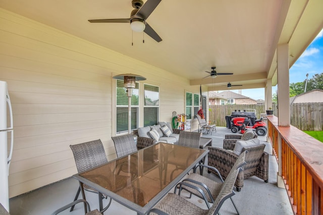 view of patio with an outdoor hangout area and ceiling fan