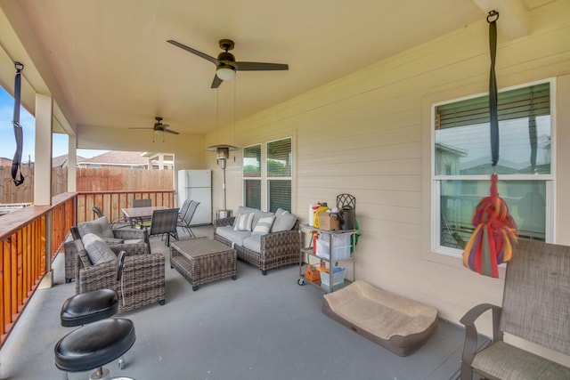 view of patio with outdoor lounge area and ceiling fan