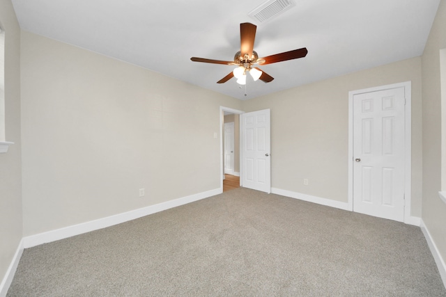 unfurnished bedroom featuring ceiling fan and carpet flooring