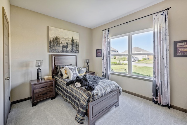 bedroom with light colored carpet