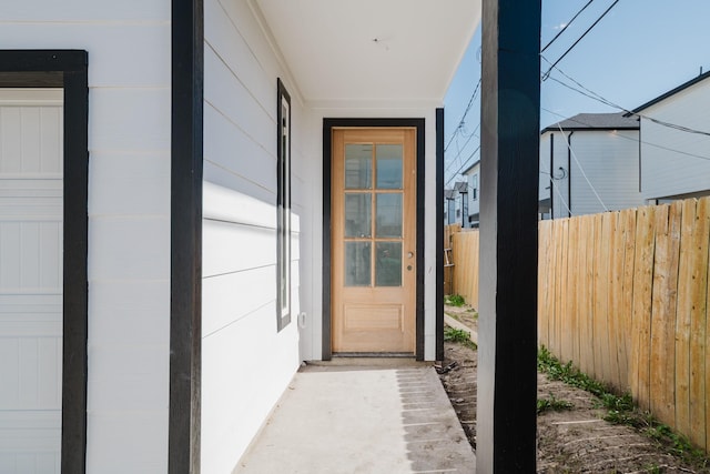 property entrance with fence