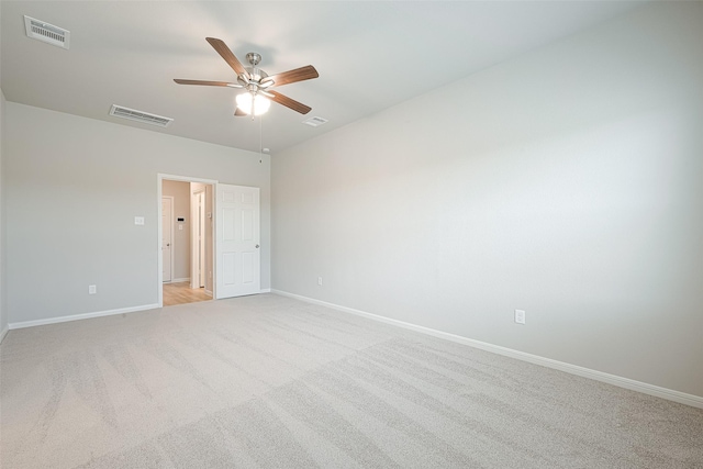 unfurnished room with light carpet and ceiling fan