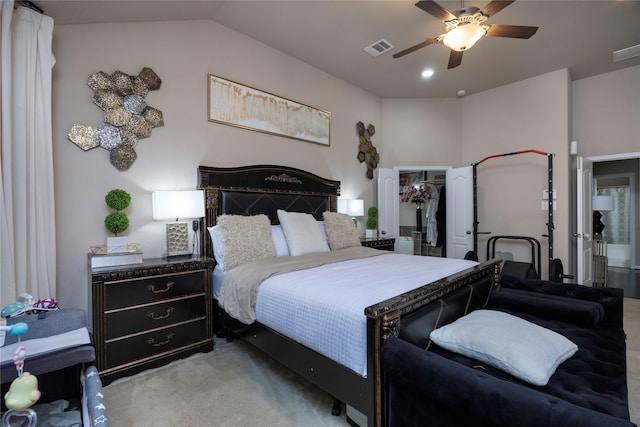 carpeted bedroom featuring vaulted ceiling and ceiling fan