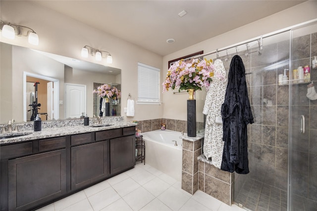 bathroom featuring vanity, separate shower and tub, and tile patterned flooring