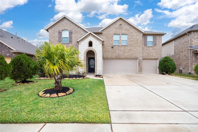 view of front of home featuring a garage and a front yard