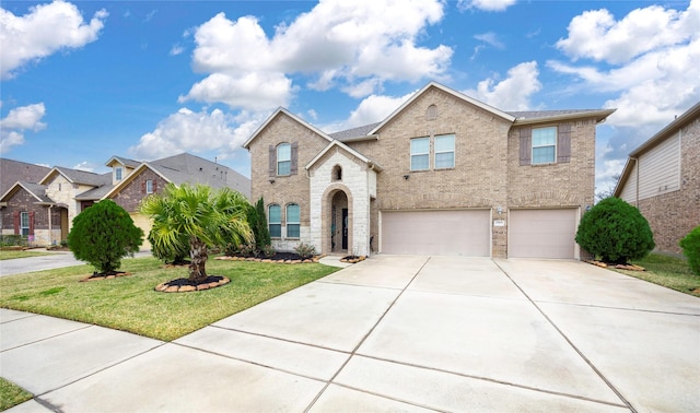 view of front of home featuring a garage and a front lawn