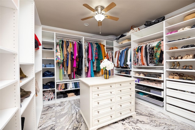 walk in closet featuring ceiling fan