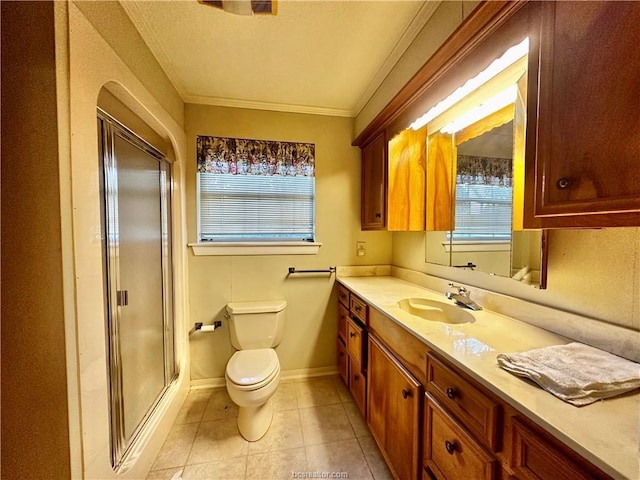 bathroom featuring crown molding, vanity, tile patterned floors, toilet, and walk in shower