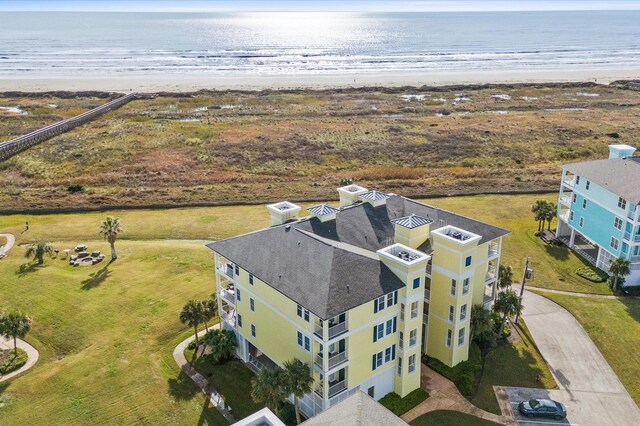 bird's eye view with a water view and a view of the beach