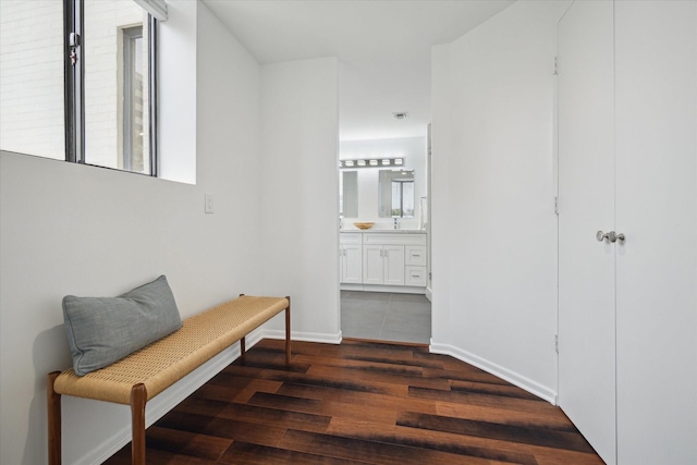 hallway featuring dark hardwood / wood-style flooring