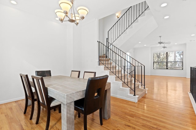 dining space featuring stairway, recessed lighting, and light wood-style flooring