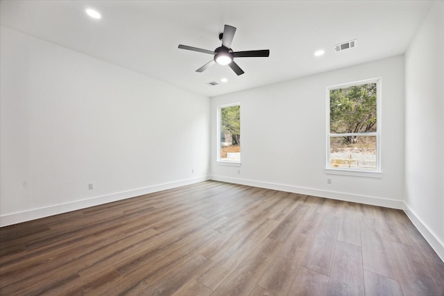 unfurnished room with hardwood / wood-style flooring and ceiling fan