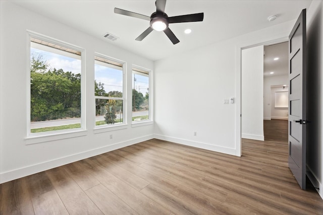 unfurnished room with ceiling fan and wood-type flooring